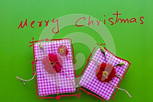 Merry christmas message card handwriting with gift box arrangement flat lay style