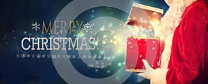 Merry Christmas message with Santa opening a gift box