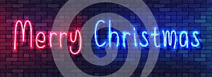 Merry Christmas Neon Colorful Banner. Handwritten Neon Alphabet on a Dark Brick Wall Background. Colorful bright drawn typeface