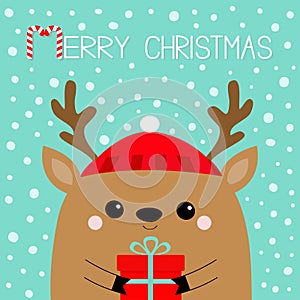 Merry Christmas. Raindeer deer head face holding gift box. Red hat, nose, horns. Happy New Year. Cute cartoon kawaii baby