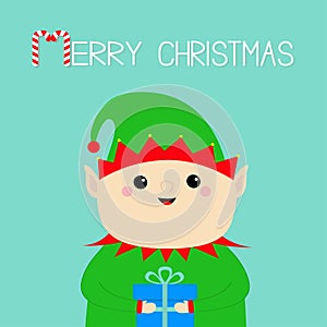 Merry Christmas. Santa Claus Elf face holding gift box. Green hat. New Year. Cute cartoon funny kawaii baby character. Greeting