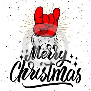 Merry christmas. Santa Claus hand with rock and roll sign.