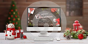 Merry Christmas scene with computer display on work desk