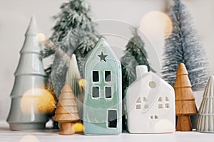 Merry Christmas! Christmas scene, miniature holiday village with lights. Christmas houses and trees