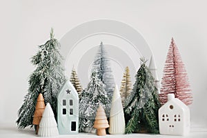 Merry Christmas! Christmas scene, miniature holiday village. Christmas little houses and trees