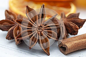 Merry Christmas, seasonal spices and Christmastime ingredients concept with  close up on cinnamon sticks, star anise and dried