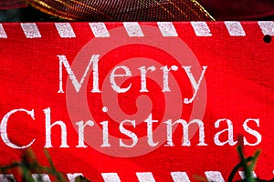 Merry Christmas sign hanging in the Christmas tree