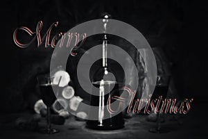 Merry Christmas Sign With Red Wine Vintage Bottle and Glasses Re