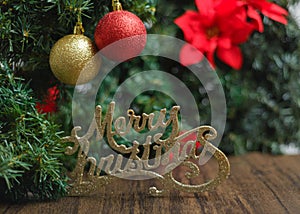 Merry Christmas sign with Christmas tree decorations.