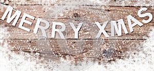 Merry Christmas sign on wooden background with copy space