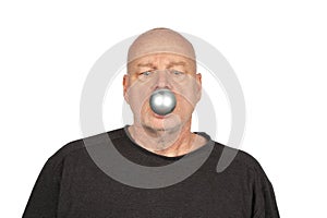 Merry Christmas: Suprised Caucasian Man with Silver Christmas Tree Ornament in Mouth, Copy Space