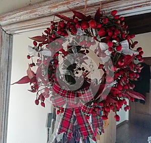 Merry Christmas Tartan  wreath made with rosehips for festive cheer