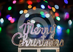 Merry Christmas text decoration with colored light spots