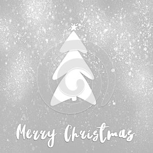 Merry Christmas text, handwritten sign on stylish simple christmas tree with star and snow on grey background. Hand drawn photo