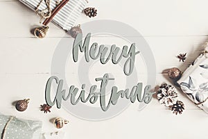 Merry christmas text, seasonal greetings card sign. flat lay. pr