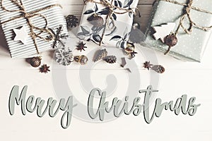 Merry christmas text, seasonal greetings card sign. flat lay. st
