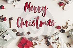 Merry christmas text, seasonal greetings card sign. wrapped pres