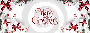 Merry Christmas text on white background with gift boxes, ribbons, red decoration, fir branches, bokeh, sparkles and confetti.