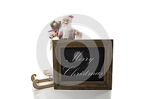 merry christmas text on whoteboard and santa claus