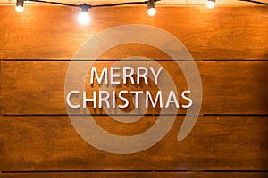 Merry Christmas Text with wooden on background