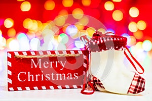 Merry Christmas text wooden sign, decorations and ornaments in a colorful Christmas composition