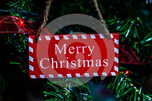 Merry Christmas text wooden sign, decorations and ornaments in a colorful Christmas composition