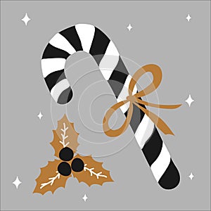 Merry Christmas traditional sweet gift candy cane with a bow and beside it lies mistletoe on a white background and gold