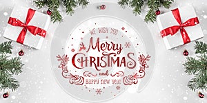 Merry Christmas Typographical on white background with gift boxes, fir branches, red decoration.