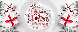 Merry Christmas Typographical on white background with gift boxes, fir branches, red decoration.