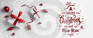 Merry Christmas Typographical on white background with gift boxes and red decoration.