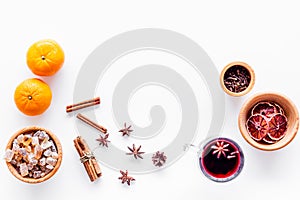 Merry christmas in winter evening with warm drink. Hot mulled wine or grog with fruits and spices on white background