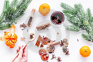 Merry christmas in winter evening with warm drink. Hot mulled wine or grog with fruits and spices on white background