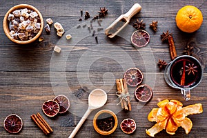 Merry christmas in winter evening with warm drink. Hot mulled wine or grog with fruits and spices on wooden background