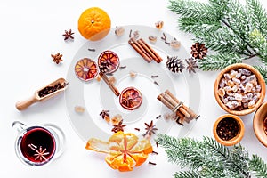 Merry christmas in winter evening with warm drink. Hot wine or grog with fruits and spices on white background top view
