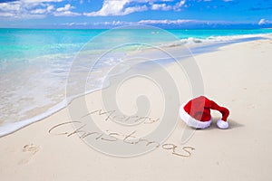 Merry Christmas written on beach white sand with