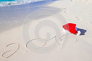 2016 and Merry Christmas written on beach white