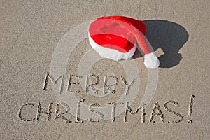 Merry Christmas written on sand