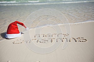 Merry Christmas written on tropical beach white