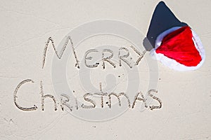 Merry Christmas written on tropical beach white