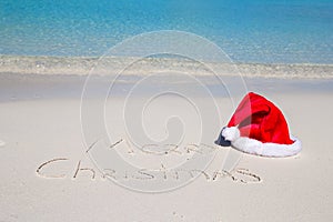 Merry Christmas written on tropical beach white