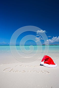 Merry Christmas written on tropical beach white