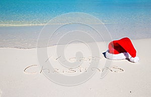 Merry Christmas written on tropical beach white