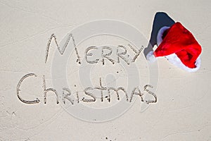 Merry Christmas written on tropical beach white