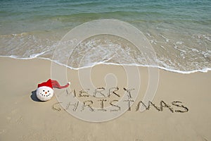 Merry Christmas written on tropical beach white sand