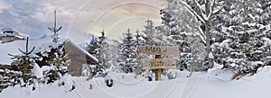 Merry christmas written on wooden postsign  in alpine mountain photo