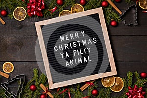 Merry Christmas Ya Filty Animal letter board on dark rustic woo