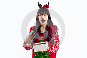 Merry Christmas, young pretty asian woman long hair style in red sweatshirt open gift box and surprised