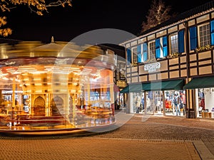 Merry go round in Designer Outlet Roermond with christmas decorations during night time