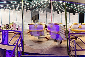 merry go round swing at night with colorful light at city fair ground from different angle