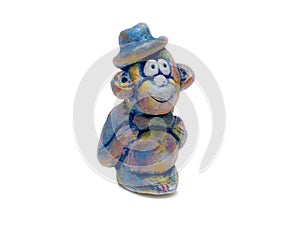 Merry monkey in blue bowler hat from clay pottery